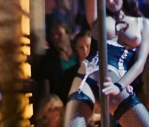 Explicit scene in the striptease club from comedy film The Internship with pole-dances