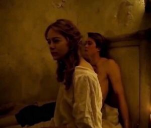 Emma Stone gets in bed to man and grabs cock to make him cum with hand in The Favourite